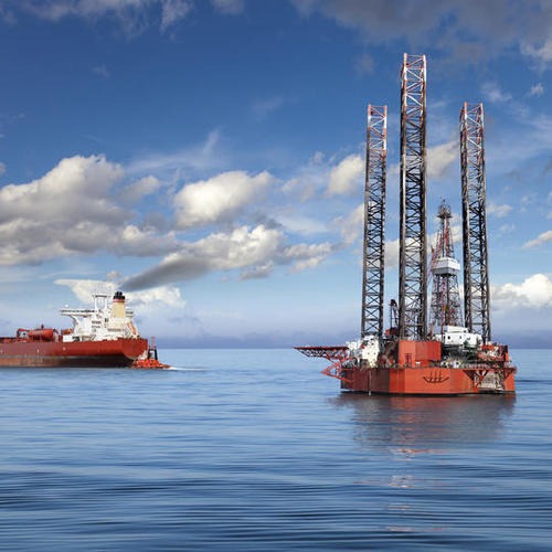 Oil rig and tanker ship on offshore area.